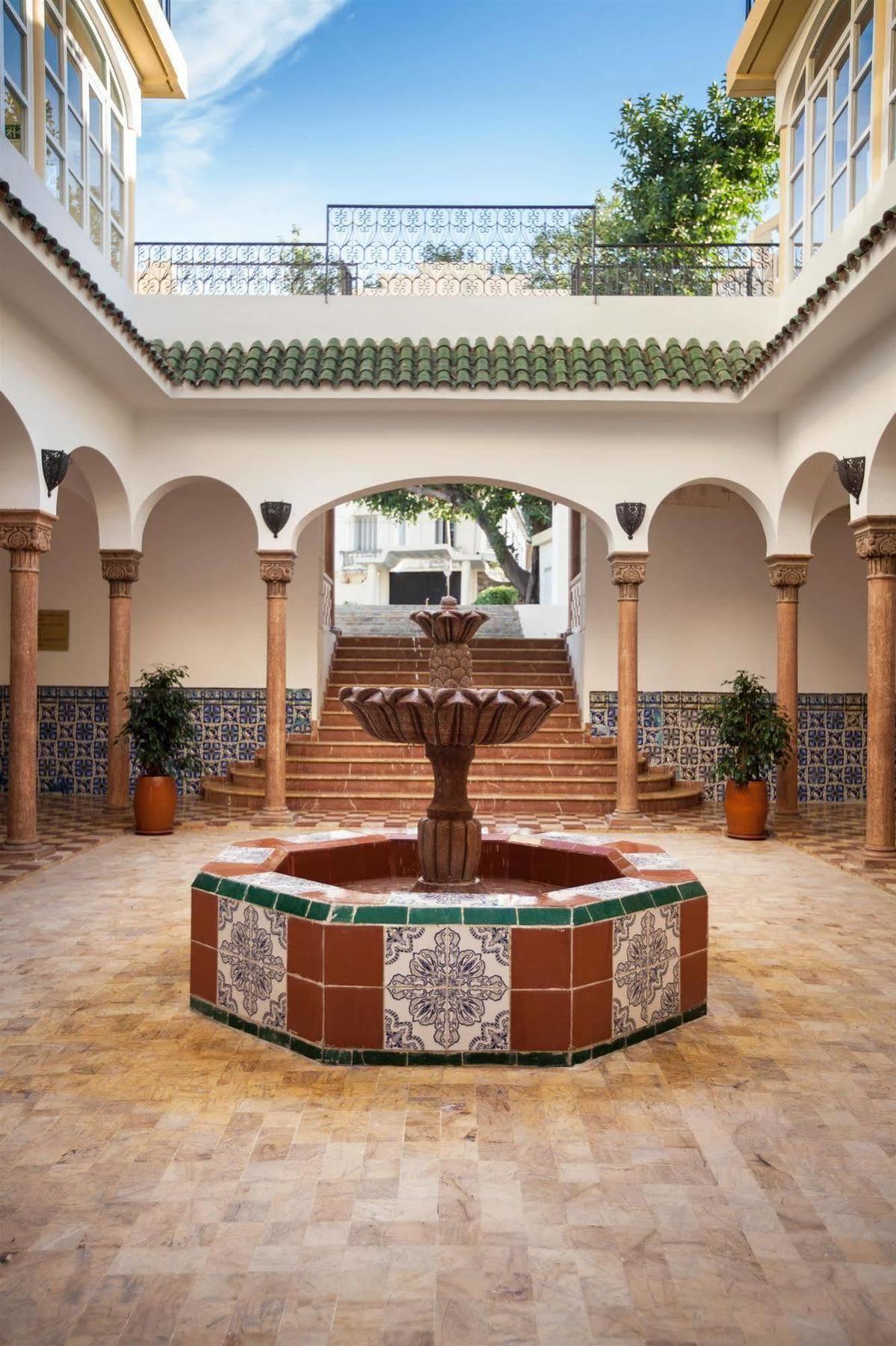 Grand Hotel Villa De France Tanger Eksteriør billede Fountain in the courtyard of the University of Málaga